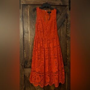 Midi length red dress with lace overlay. NWT